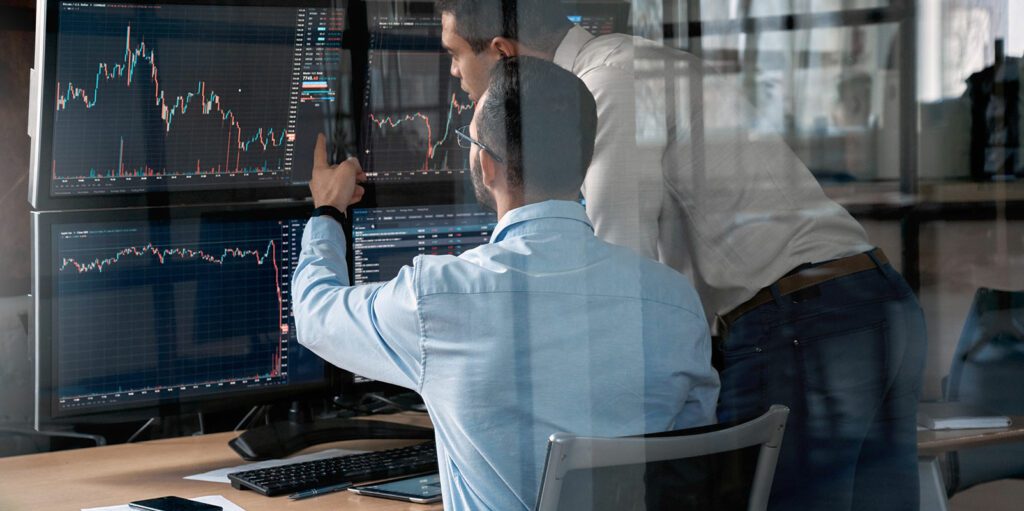Traders looking at computer screens.