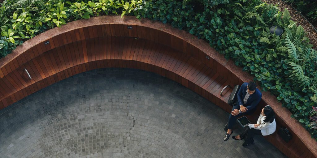 People sitting on a park bench.